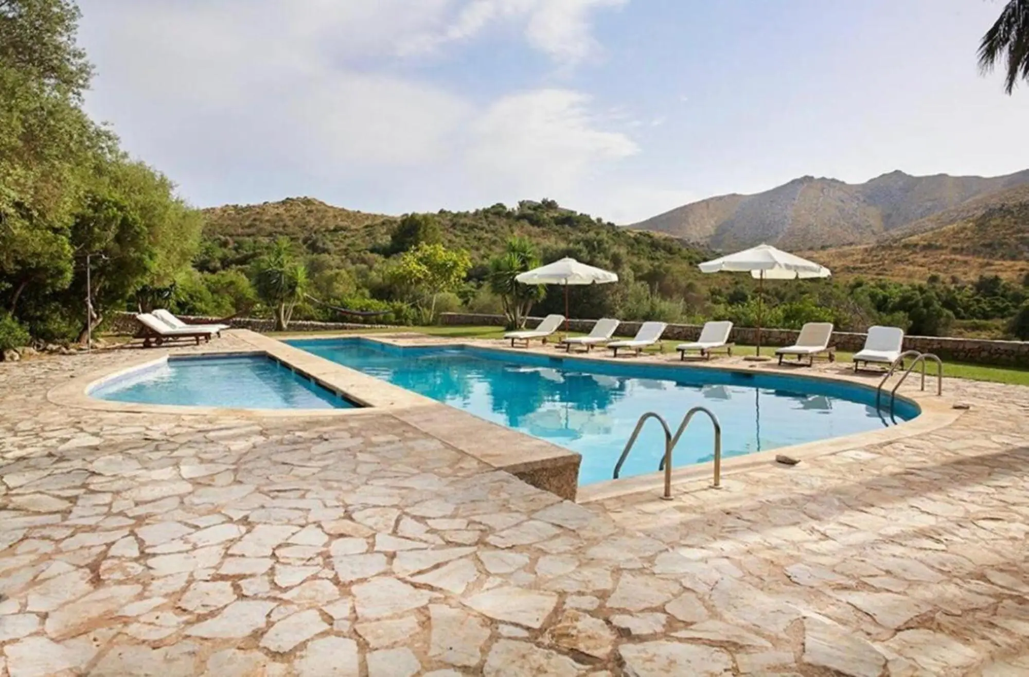 Second pool on a natural stone terrace with a view to the mountains