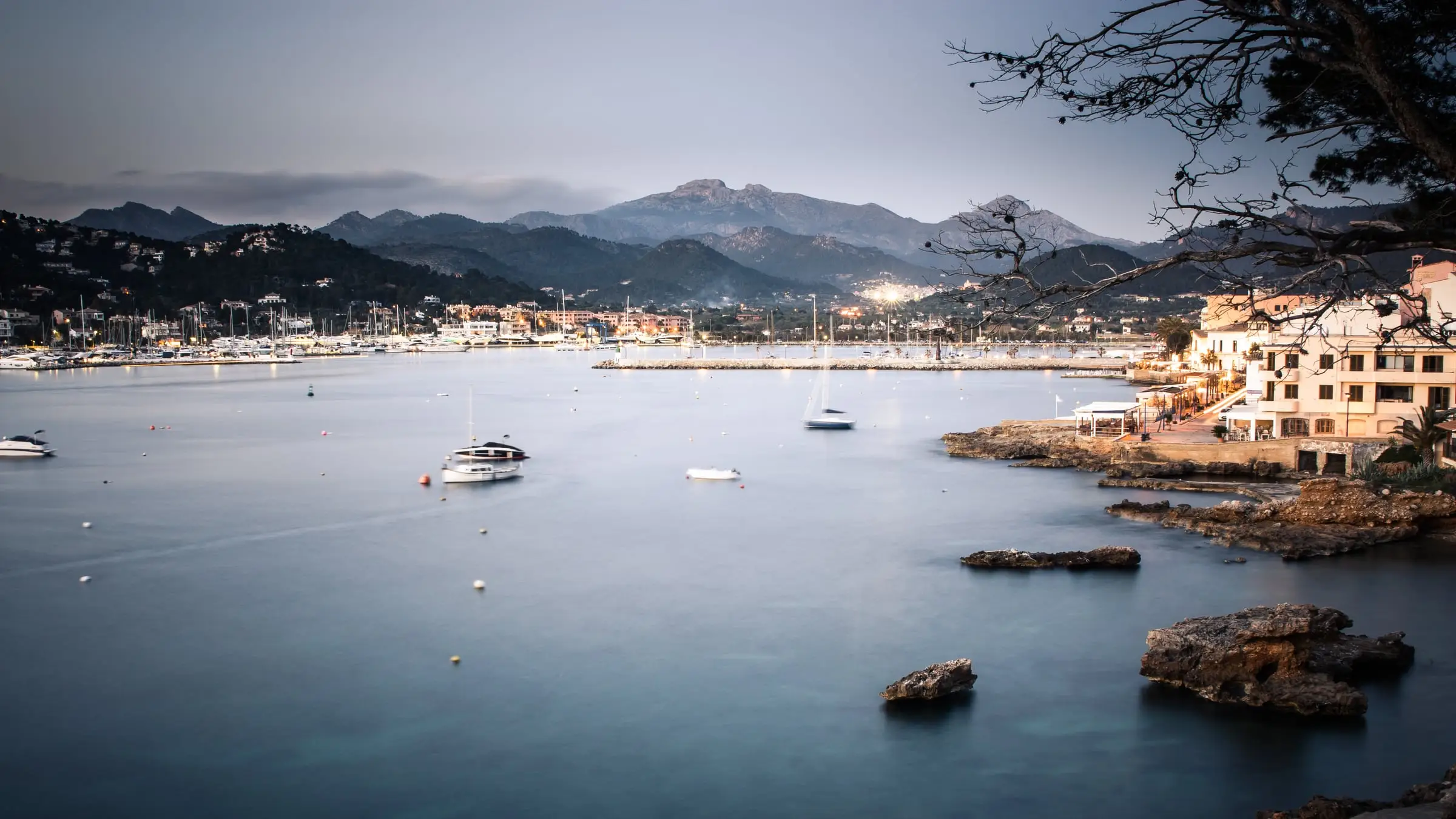 The natural harbour of Port d'Andratx at blue hour, the Serra de Tramuntana behind