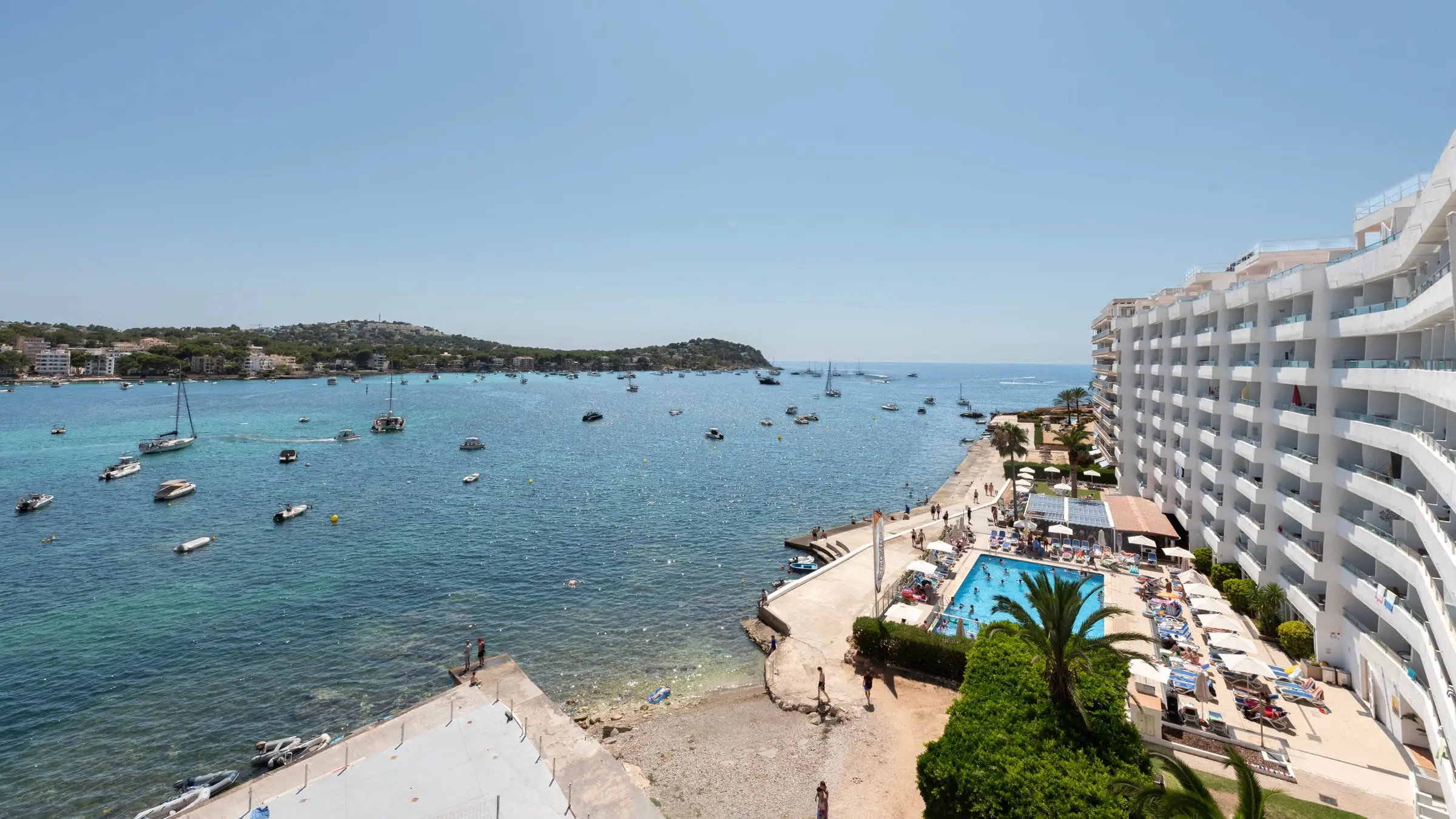 The bay of Santa Ponsa with boats at anchor, the seafront development to the right