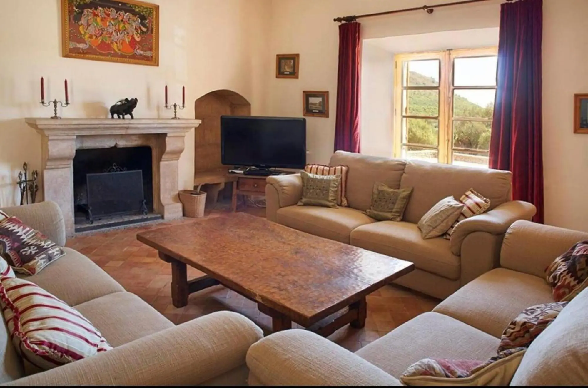 Living room with sandstone fireplace and seating